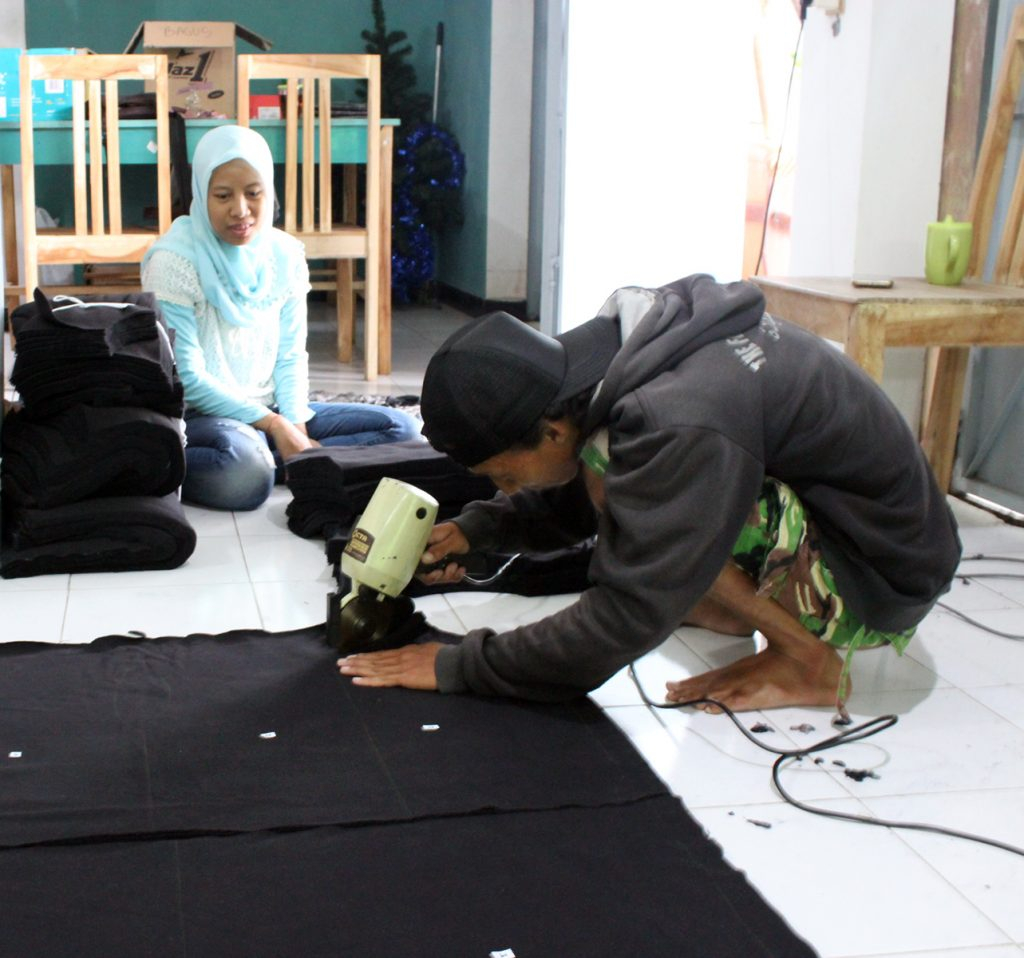 Cutting Fabric by Baki Clothing Company