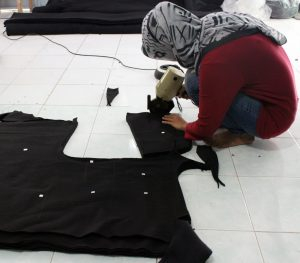 Cutting Fabric by Baki Clothing Company
